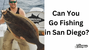 Man holding a large fish on a boat with the logo 'Boundless Charters' in the background. The text on the right reads 'Can You Go Fishing in San Diego?